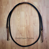 Our adjustable horse training rope neck with leather poppers are available with many options. The standard neck rope has a braided slider to easily adjust proper length. Many options available. Perfect for Bridleless and Liberty Training.